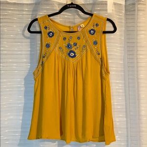 Mustard yellow sleeveless shirt